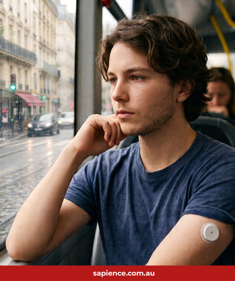 young man wearing a diabetes glucose body sensor