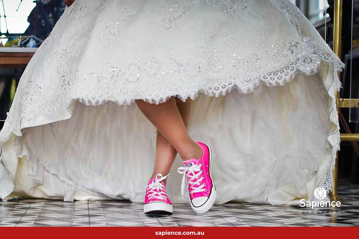 wearing pink sneakers under white wedding dress