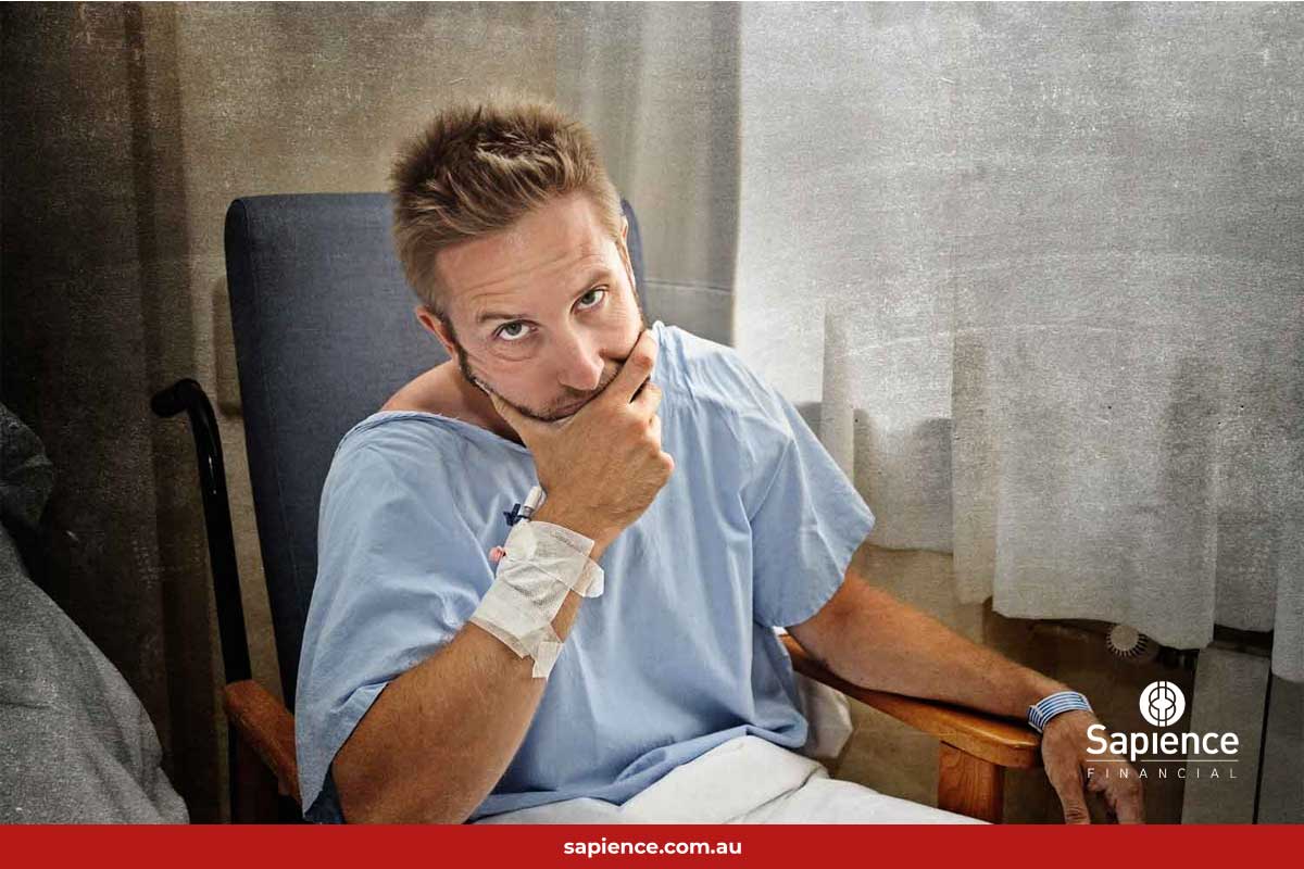 frustrated man in hospital gown looking at you