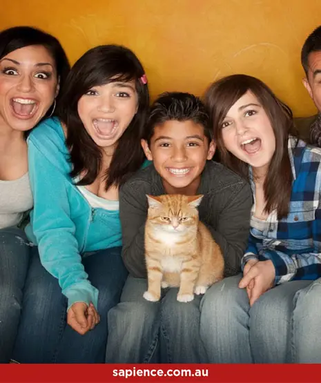 happy step family and their grumpy cat
